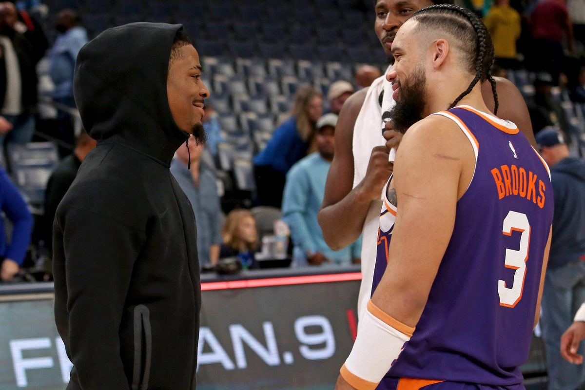 Jan 7, 2026; Memphis, Tennessee, USA; Memphis Grizzlies guard Ja Morant (left) talks with Phoenix Suns forward Dillon Brooks (3) after the game at FedExForum. Mandatory Credit: Petre Thomas-Imagn Images