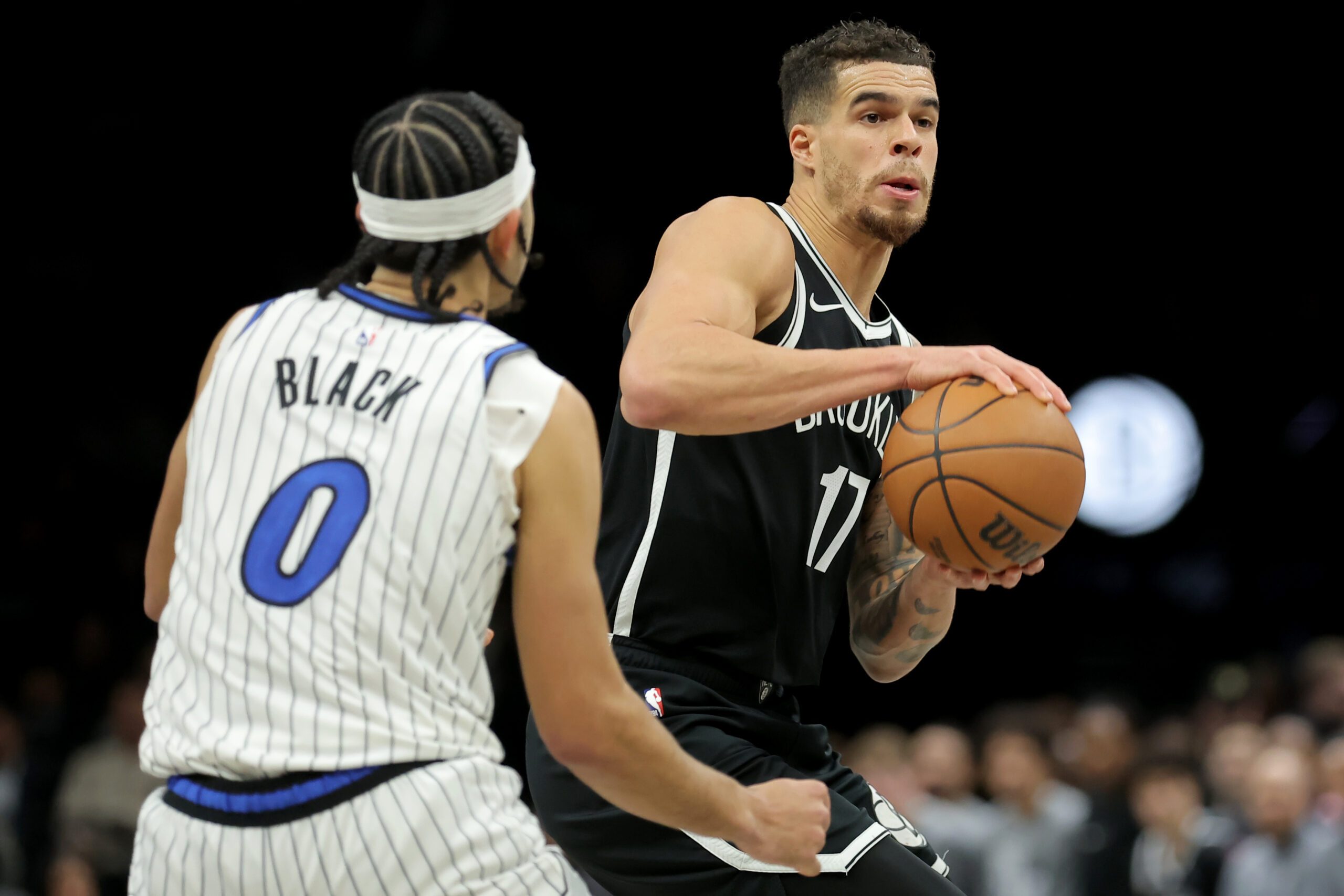 Jan 7, 2026; Brooklyn, New York, USA; Brooklyn Nets forward Michael Porter Jr. (17) controls the ball against Orlando Magic guard Anthony Black (0) during the third quarter at Barclays Center. Mandatory Credit: Brad Penner-Imagn Images