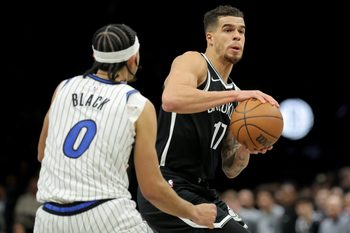 Jan 7, 2026; Brooklyn, New York, USA; Brooklyn Nets forward Michael Porter Jr. (17) controls the ball against Orlando Magic guard Anthony Black (0) during the third quarter at Barclays Center. Mandatory Credit: Brad Penner-Imagn Images