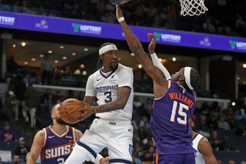 Jan 7, 2026; Memphis, Tennessee, USA; Memphis Grizzlies forward Kentavious Caldwell-Pope (3) passes the ball as Phoenix Suns center Mark Williams (15) defends during the fourth quarter at FedExForum. Mandatory Credit: Petre Thomas-Imagn Images