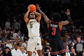 Jan 7, 2026; Boulder, Colorado, USA; Colorado Buffaloes guard Josiah Sanders (5) shoots the ball over Utah Utes guard Don McHenry (3) in the second half at CU Events Center. Mandatory Credit: Ron Chenoy-Imagn Images