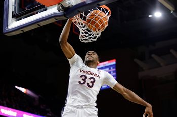 Jan 7, 2026; Charlottesville, Virginia, USA; Virginia Cavaliers center Ugonna Onyenso (33) dunks the ball against the California Golden Bears during the second half at John Paul Jones Arena. Mandatory Credit: Amber Searls-Imagn Images