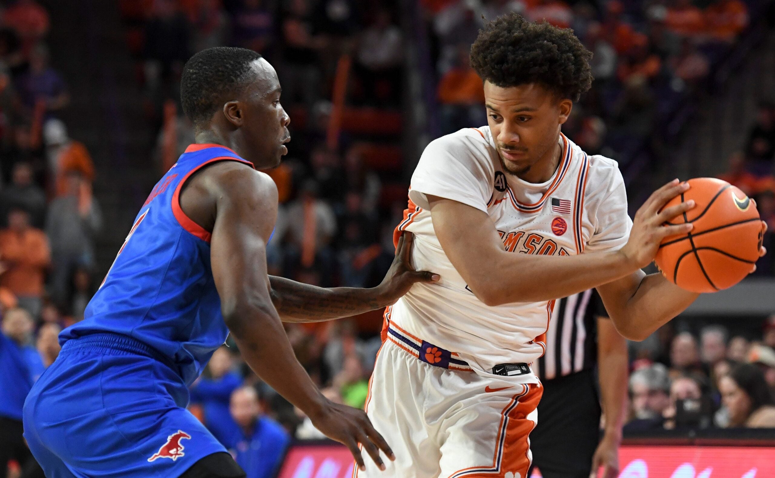 SMU Mustangs guard Boopie Miller (2) defends Clemson Tigers guard Efrem Johnson (4) Wednesday, Jan. 7, 2026, during the NCAA men’s basketball game at Littlejohn Coliseum in Clemson, South Carolina. Clemson Tigers won 74-70.