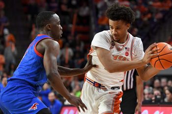 SMU Mustangs guard Boopie Miller (2) defends Clemson Tigers guard Efrem Johnson (4) Wednesday, Jan. 7, 2026, during the NCAA men’s basketball game at Littlejohn Coliseum in Clemson, South Carolina. Clemson Tigers won 74-70.
