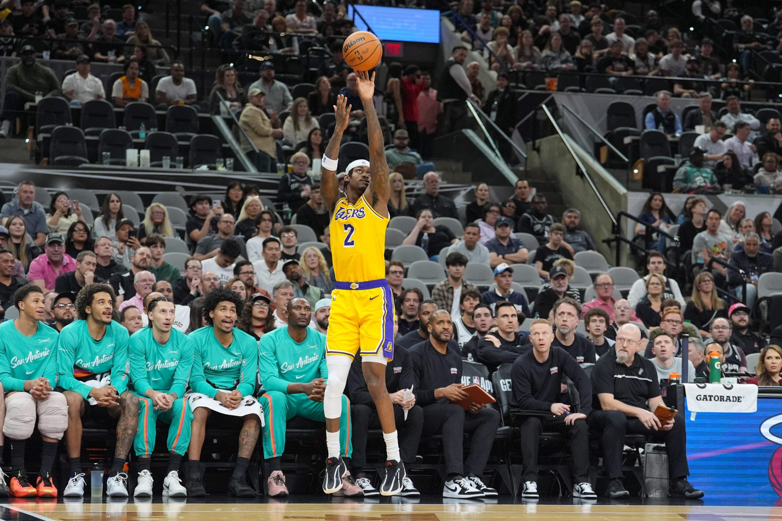 Jan 7, 2026; San Antonio, Texas, USA;  Los Angeles Lakers forward Jarred Vanderbilt (2) shoots in front of the San Antonio Spurs’ bench in the second half at Frost Bank Center. Mandatory Credit: Daniel Dunn-Imagn Images