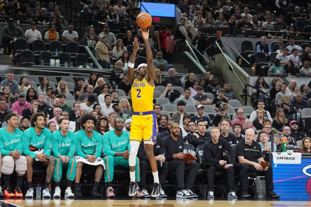 Jan 7, 2026; San Antonio, Texas, USA; Los Angeles Lakers forward Jarred Vanderbilt (2) shoots in front of the San Antonio Spurs’ bench in the second half at Frost Bank Center. Mandatory Credit: Daniel Dunn-Imagn Images