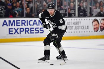Jan 7, 2026; Los Angeles, California, USA; Los Angeles Kings right wing Adrian Kempe (9) controls the puck against the San Jose Sharks during the overtime period at Crypto.com Arena. Mandatory Credit: Gary A. Vasquez-Imagn Images