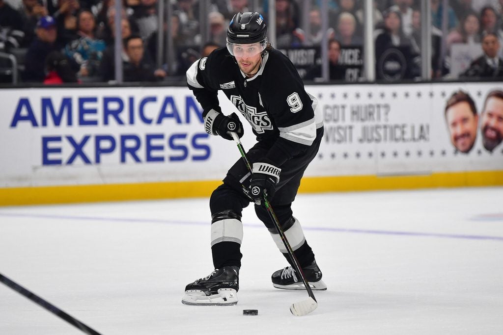 Jan 7, 2026; Los Angeles, California, USA; Los Angeles Kings right wing Adrian Kempe (9) controls the puck against the San Jose Sharks during the overtime period at Crypto.com Arena. Mandatory Credit: Gary A. Vasquez-Imagn Images