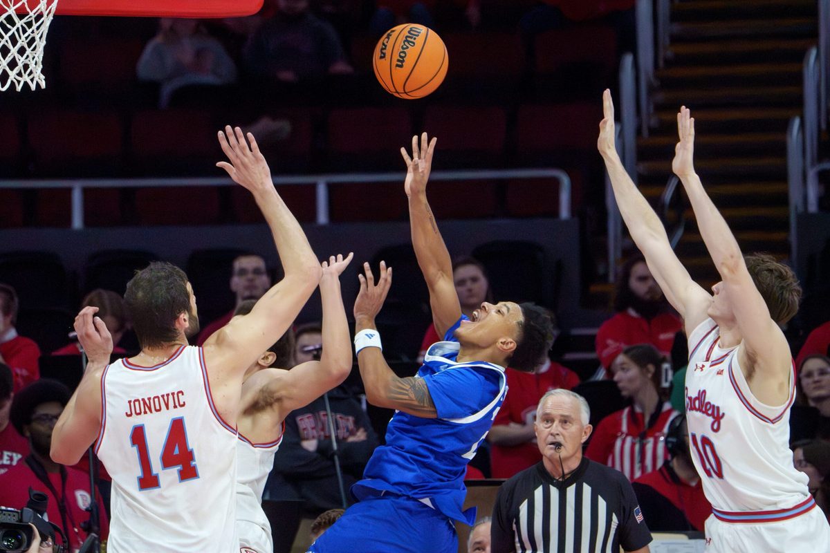 Drake’s Jaehshon Thomas, middle, gets off a shot between Bradley defenders in the second half of their college basketball game Wednesday, Jan. 7, 2026 at Carver Arena in Peoria. The Braves defeated the Bulldogs 93-66.