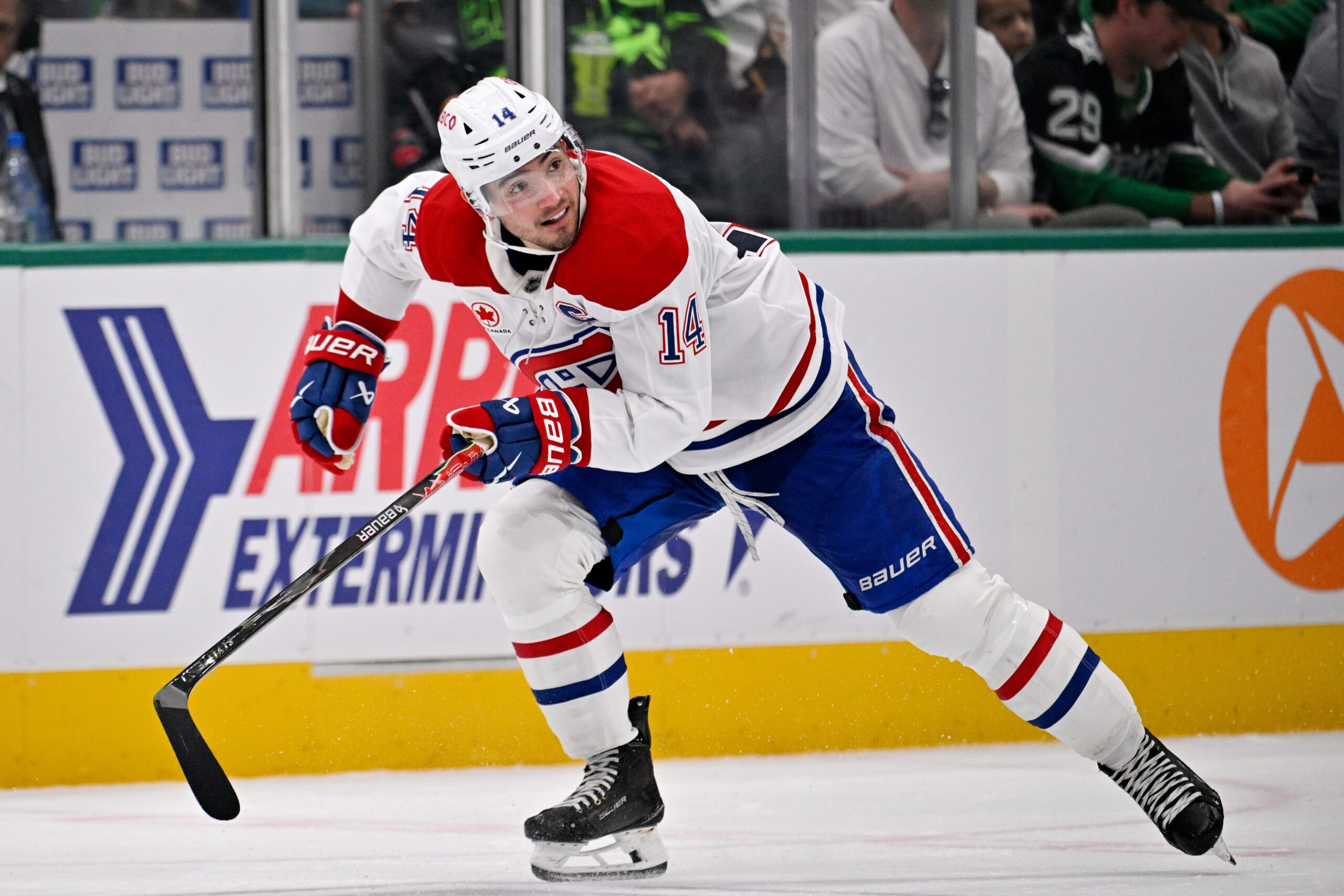 Jan 4, 2026; Dallas, Texas, USA; Montreal Canadiens center Nick Suzuki (14) skates against the Dallas Stars during the game between the Stars and the Canadiens at the American Airlines Center. Mandatory Credit: Jerome Miron-Imagn Images