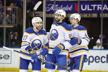 Jan 8, 2026; New York, New York, USA;  Buffalo Sabres right wing Alex Tuch (89) celebrates with left wing Jason Zucker (17) and defenseman Bowen Byram (4) after scoring a goal in the second period against the New York Rangers at Madison Square Garden. Mandatory Credit: Wendell Cruz-Imagn Images