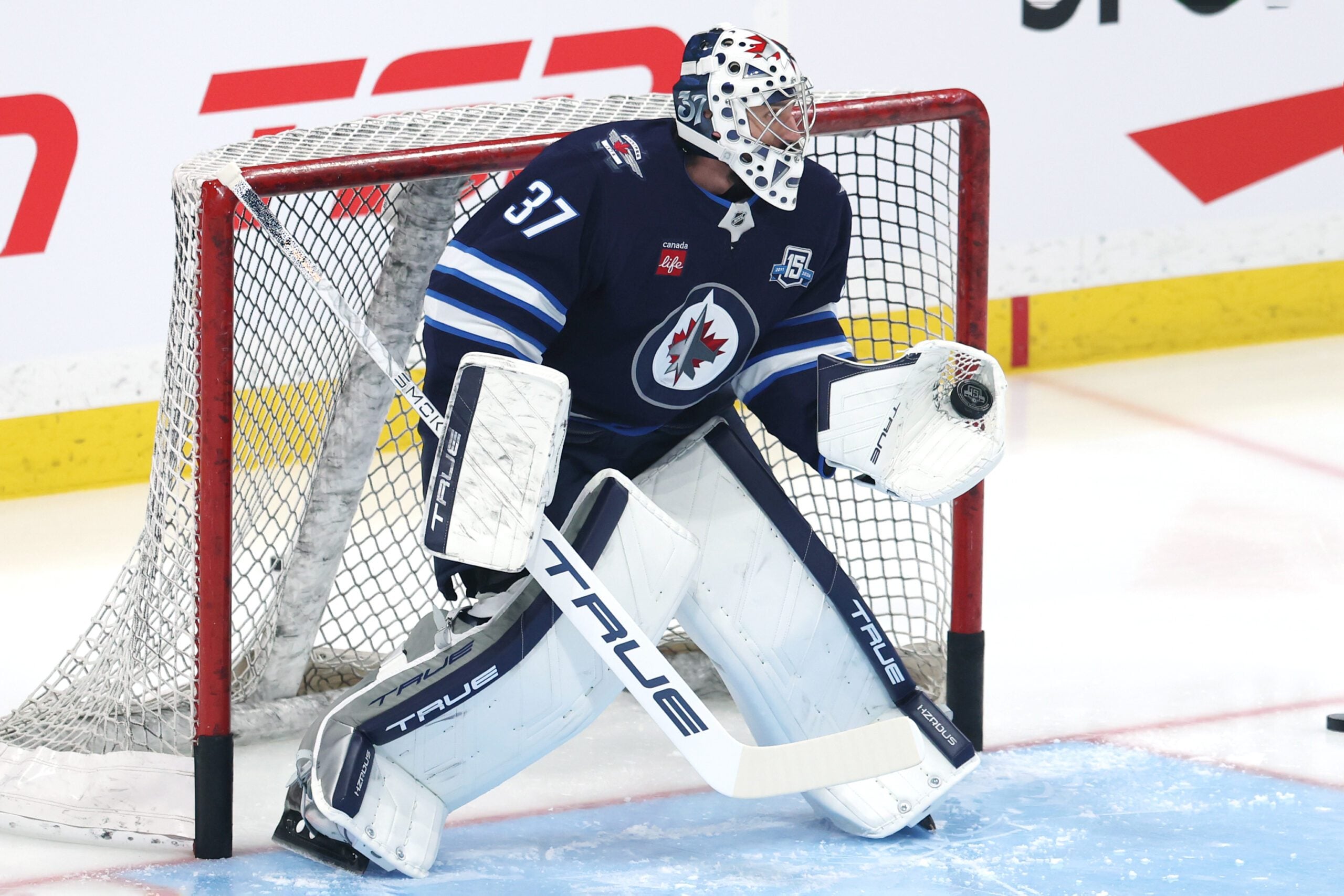 Jan 8, 2026; Winnipeg, Manitoba, CAN; Winnipeg Jets goaltender Connor Hellebuyck (37) warms up before a game against the Edmonton Oilers at Canada Life Centre. Mandatory Credit: James Carey Lauder-Imagn Images