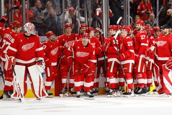 Jan 8, 2026; Detroit, Michigan, USA;  Detroit Red Wings right wing Patrick Kane (88) receives congratulations from teammates after he scores his 500 career goal in the third period against the Vancouver Canucks at Little Caesars Arena. Mandatory Credit: Rick Osentoski-Imagn Images