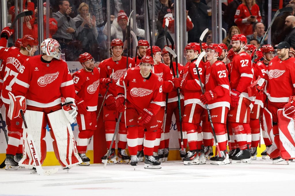 Jan 8, 2026; Detroit, Michigan, USA; Detroit Red Wings right wing Patrick Kane (88) receives congratulations from teammates after he scores his 500 career goal in the third period against the Vancouver Canucks at Little Caesars Arena. Mandatory Credit: Rick Osentoski-Imagn Images