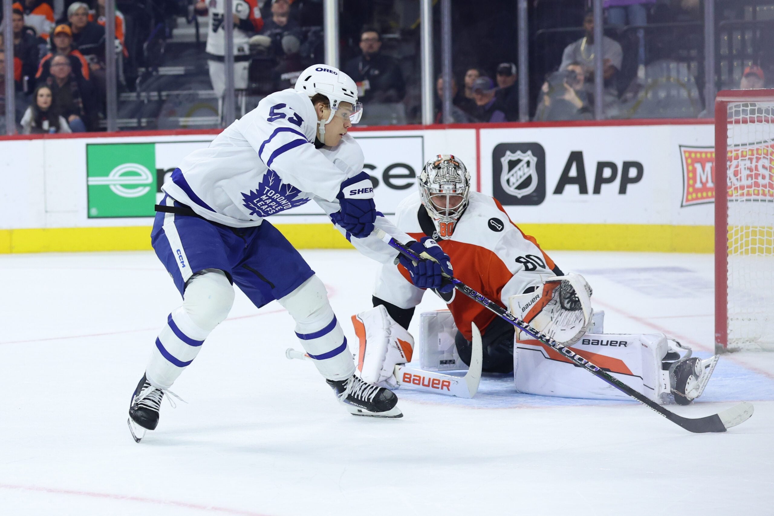 Jan 8, 2026; Philadelphia, Pennsylvania, USA; Philadelphia Flyers goaltender Dan Vladar (80) makes a save on Toronto Maple Leafs right wing Easton Cowan (53) during overtime at Xfinity Mobile Arena. Mandatory Credit: Bill Streicher-Imagn Images