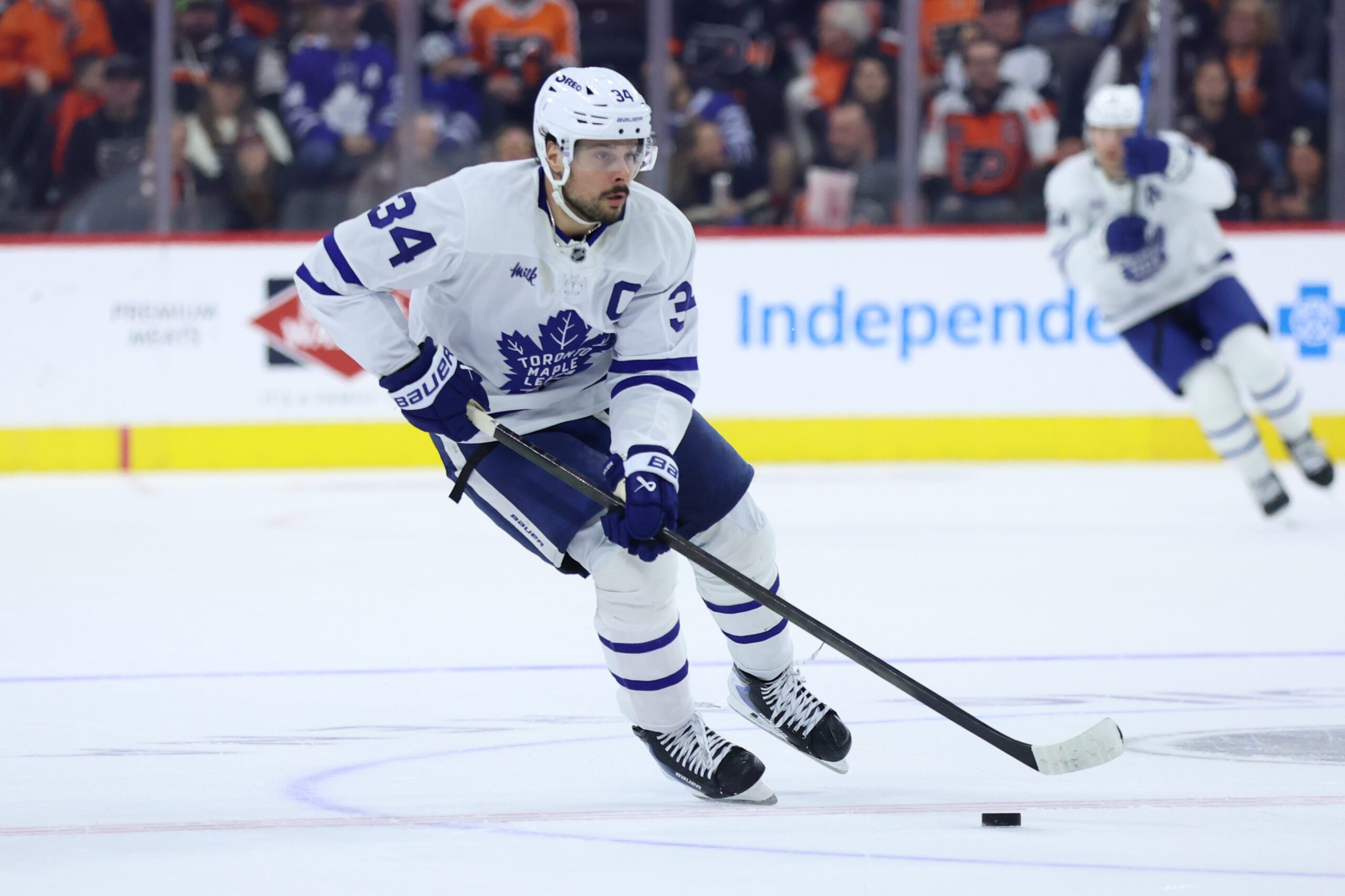 Jan 8, 2026; Philadelphia, Pennsylvania, USA; Toronto Maple Leafs center Auston Matthews (34) skates with the puck against the Philadelphia Flyers during overtime at Xfinity Mobile Arena. Mandatory Credit: Bill Streicher-Imagn Images