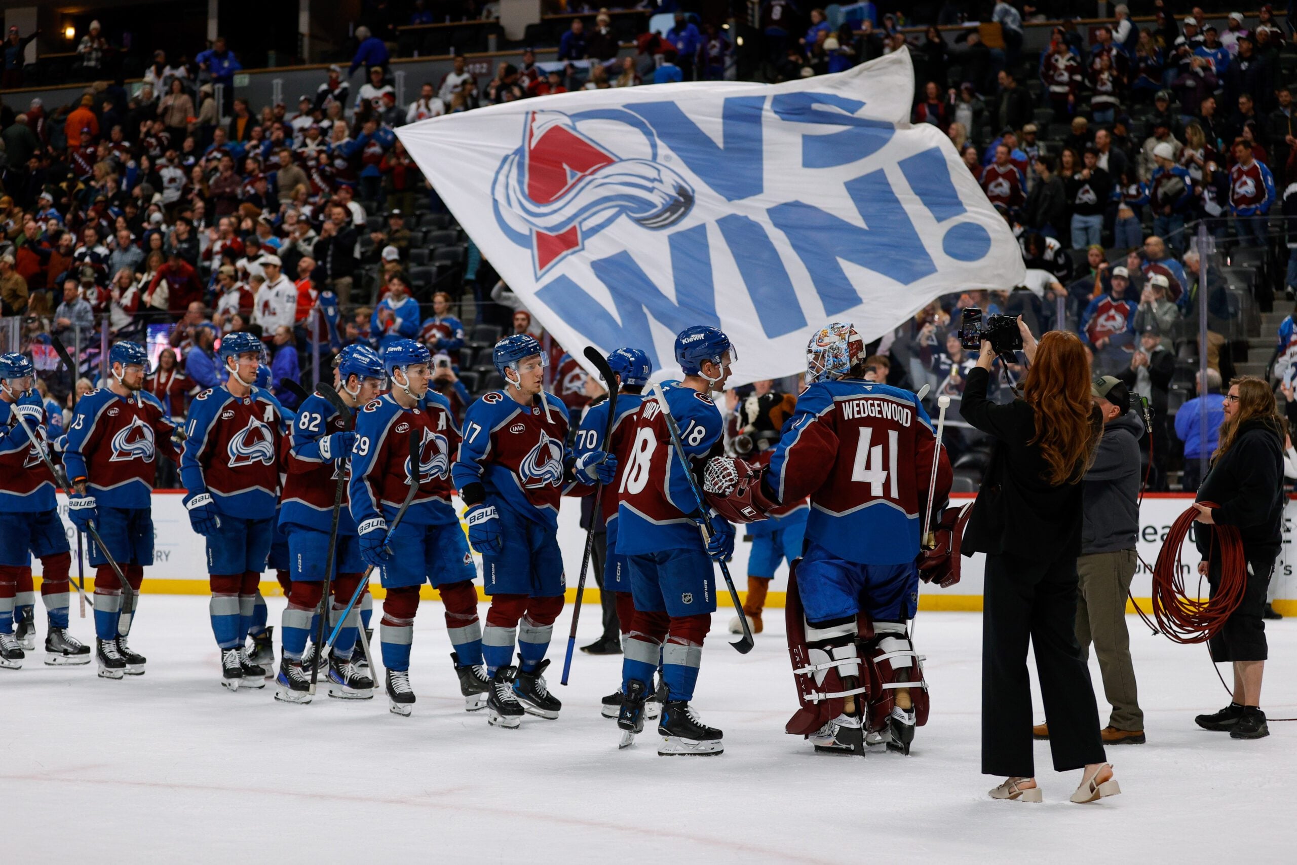 Jan 8, 2026; Denver, Colorado, USA; Colorado Avalanche players celebrate after the game against the Ottawa Senators at Ball Arena. Mandatory Credit: Isaiah J. Downing-Imagn Images