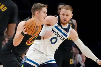 Jan 8, 2026; Minneapolis, Minnesota, USA; Cleveland Cavaliers guard Sam Merrill (5) works around Minnesota Timberwolves guard Donte DiVincenzo (0) in the fourth quarter at Target Center. Mandatory Credit: Bruce Kluckhohn-Imagn Images