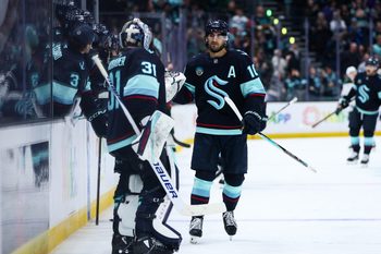 Jan 8, 2026; Seattle, Washington, USA; Seattle Kraken center Matty Beniers (10) celebrates a goal in the third period against the Minnesota Wild at Climate Pledge Arena. Mandatory Credit: Kevin Ng-Imagn Images
