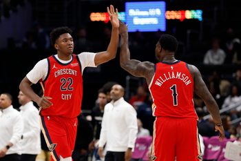 Jan 9, 2026; Washington, District of Columbia, USA; New Orleans Pelicans center Derik Queen (22) celebrates with Pelicans forward Zion Williamson (1) against the Washington Wizards in the second half at Capital One Arena. Mandatory Credit: Geoff Burke-Imagn Images
