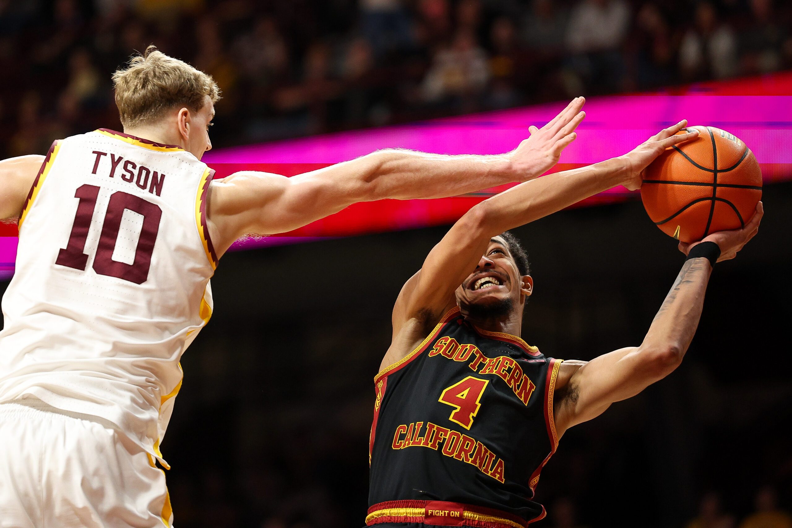 Jan 9, 2026; Minneapolis, Minnesota, USA; Southern California Trojans forward Chad Baker-Mazara (4) shoots as Minnesota Golden Gophers forward Cade Tyson (10) defends during the second half at Williams Arena. Mandatory Credit: Matt Krohn-Imagn Images