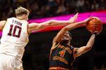 Jan 9, 2026; Minneapolis, Minnesota, USA; Southern California Trojans forward Chad Baker-Mazara (4) shoots as Minnesota Golden Gophers forward Cade Tyson (10) defends during the second half at Williams Arena. Mandatory Credit: Matt Krohn-Imagn Images