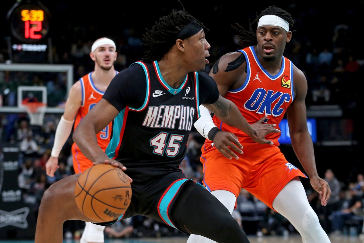 Jan 9, 2026; Memphis, Tennessee, USA; Memphis Grizzlies forward GG Jackson II (45) dribbles as Oklahoma City Thunder guard Luguentz Dort (5) defends during the fourth quarter at FedExForum. Mandatory Credit: Petre Thomas-Imagn Images