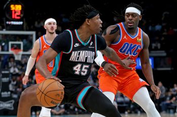 Jan 9, 2026; Memphis, Tennessee, USA; Memphis Grizzlies forward GG Jackson II (45) dribbles as Oklahoma City Thunder guard Luguentz Dort (5) defends during the fourth quarter at FedExForum. Mandatory Credit: Petre Thomas-Imagn Images