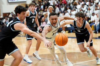 Jan 9, 2026; Tuscaloosa, AL, USA; Paul Bryant's Cameron Walton (11) chases a loose ball with Northridge's Adam Hall (24) and Northridge's James Walker (3) at Paul W. Bryant High.