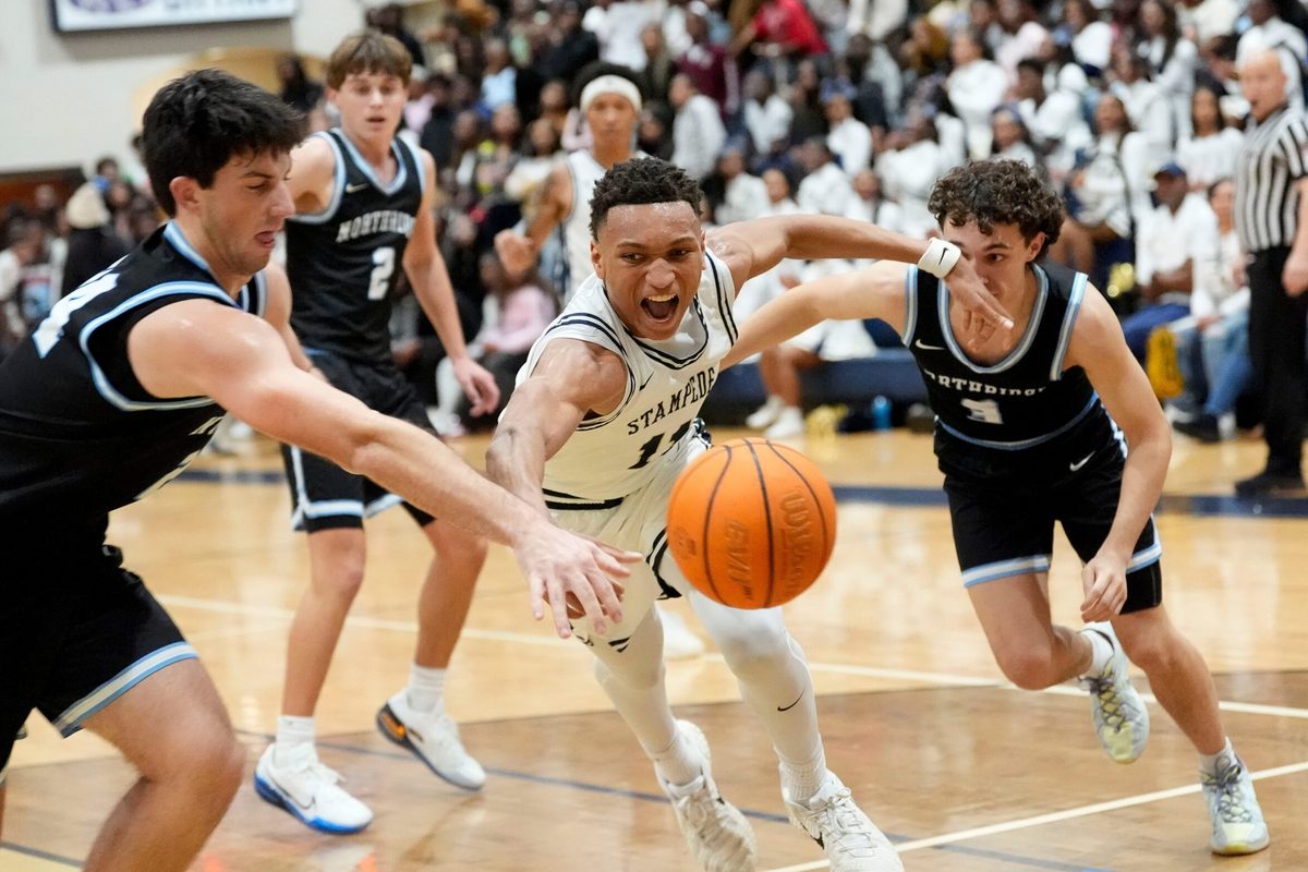 Jan 9, 2026; Tuscaloosa, AL, USA; Paul Bryant's Cameron Walton (11) chases a loose ball with Northridge's Adam Hall (24) and Northridge's James Walker (3) at Paul W. Bryant High.