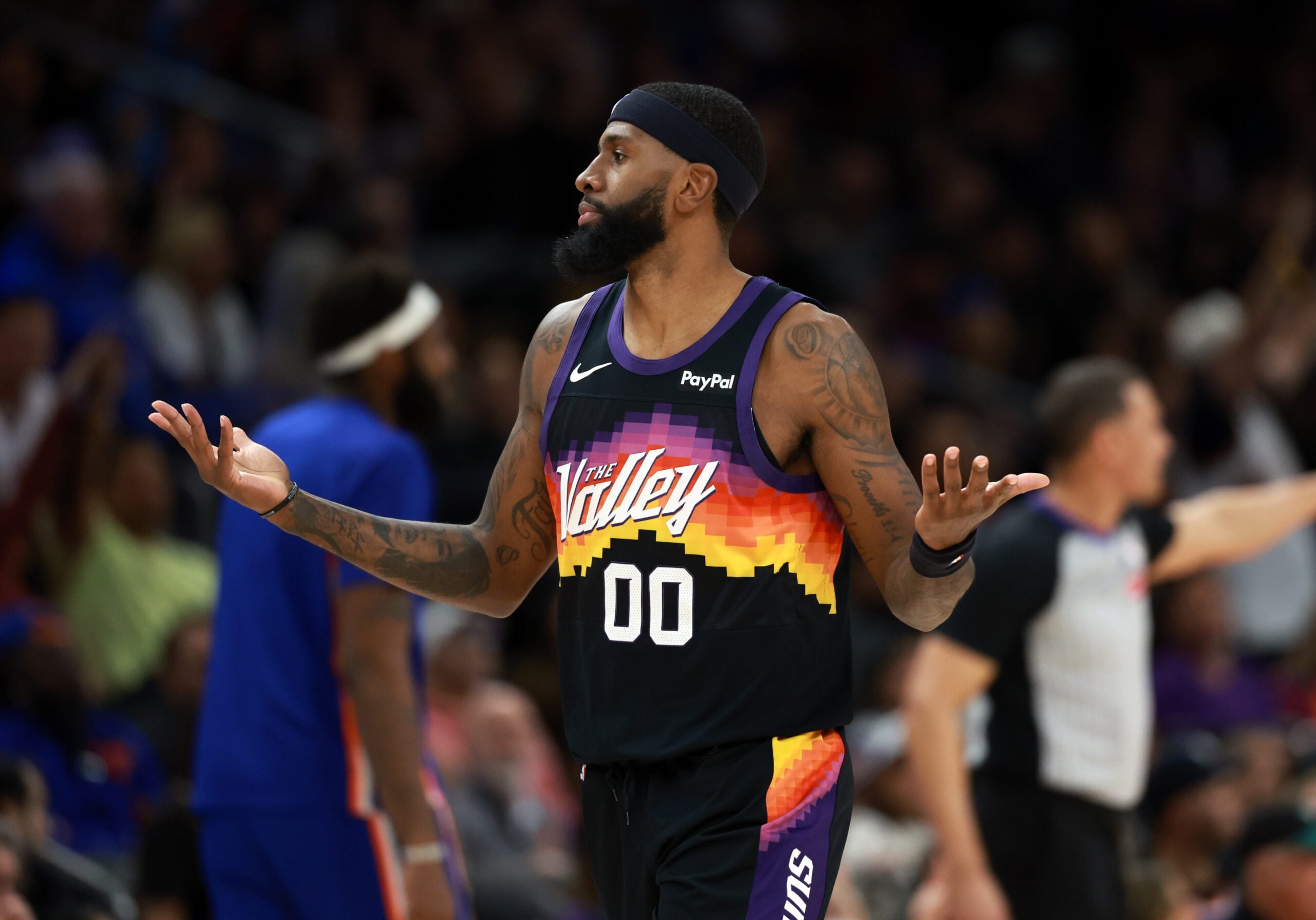 Jan 9, 2026; Phoenix, Arizona, USA; Phoenix Suns forward Royce O'Neale (00) reacts against the New York Knicks in the second half at Mortgage Matchup Center. Mandatory Credit: Mark J. Rebilas-Imagn Images