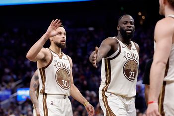 Jan 9, 2026; San Francisco, California, USA; Golden State Warriors guard Stephen Curry (30) and forward Draymond Green (23) high five guard Brandin Podziemski (2) after a play against the Sacramento Kings during the fourth quarter at Chase Center. Mandatory Credit: Kelley L Cox-Imagn Images