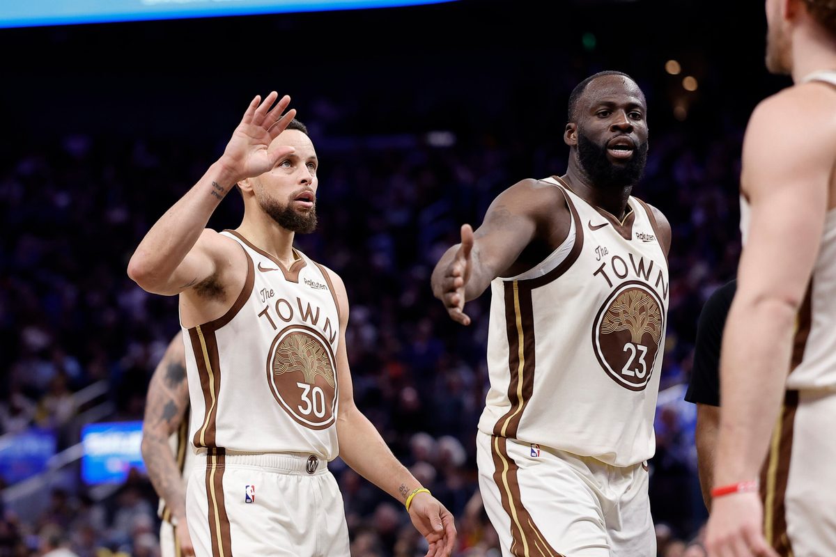Jan 9, 2026; San Francisco, California, USA; Golden State Warriors guard Stephen Curry (30) and forward Draymond Green (23) high five guard Brandin Podziemski (2) after a play against the Sacramento Kings during the fourth quarter at Chase Center. Mandatory Credit: Kelley L Cox-Imagn Images