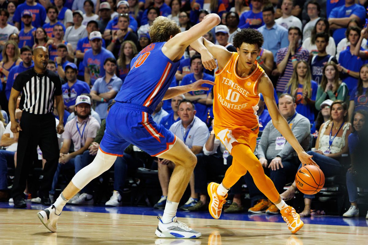 Jan 10, 2026; Gainesville, Florida, USA; Tennessee Volunteers forward Nate Ament (10) drives to the basket at Florida Gators forward Thomas Haugh (10) during the first half at Exactech Arena at the Stephen C. O'Connell Center. Mandatory Credit: Matt Pendleton-Imagn Images