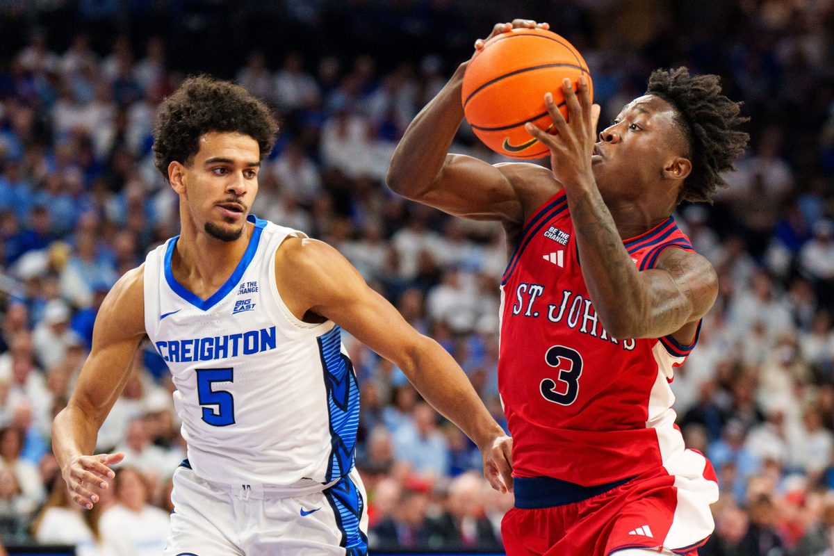 Jan 10, 2026; Omaha, Nebraska, USA; St. John's Red Storm guard Joson Sanon (3) drives to the hoop against Creighton Bluejays guard Nik Graves (5) during the first half at CHI Health Center Omaha. Mandatory Credit: Dylan Widger-Imagn Images