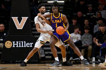 Jan 10, 2026; Nashville, Tennessee, USA; Vanderbilt Commodores forward Jalen Washington (13) and Louisiana State Tigers center Michael Nwoko (1) fight for position during the second half at Memorial Gymnasium. Mandatory Credit: Steve Roberts-Imagn Images