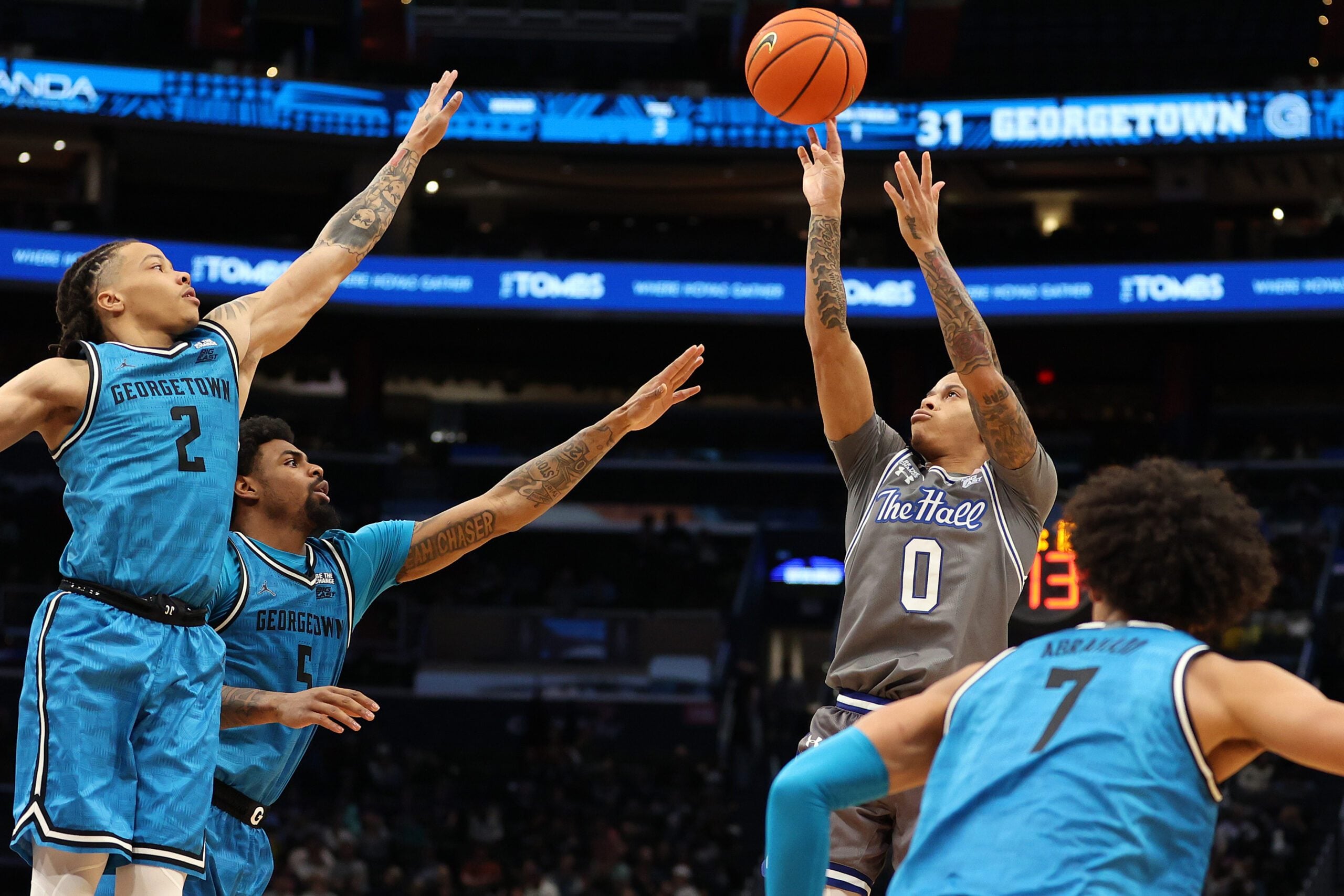 Jan 10, 2026; Washington, District of Columbia, USA; Seton Hall Pirates guard Adam Clark (0) takes a shot over Georgetown Hoyas guard Malik Mack (2), Georgetown Hoyas guard KJ Lewis (5) and Georgetown Hoyas forward Isaiah Abraham (7) during the second half at Capital One Arena. Mandatory Credit: Daniel Kucin Jr.-Imagn Images