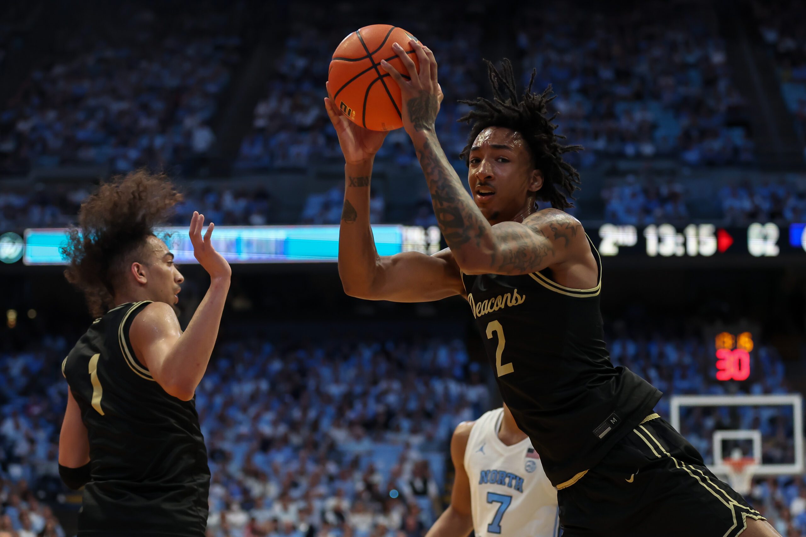 Jan 10, 2026; Chapel Hill, North Carolina, USA; Wake Forest Demon Deacons forward Juke Harris (2) grabs a rebound against the North Carolina Tar Heels during the second half at Dean E. Smith Center. Mandatory Credit: Cory Knowlton-Imagn Images