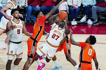 Iowa State Cyclones forward Killyan Toure (27) shoots the ball as Oklahoma State Cowboys guard Christian Coleman (4) defends during the second half in the Big-12 men’s basketball on Jan. 10, 2026, at Hilton Coliseum in Ames, Iowa.