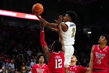 Jan 10, 2026; Boulder, Colorado, USA; Colorado Buffaloes guard Isaiah Johnson (2) shoots the ball over Texas Tech Red Raiders forward Donovan Atwell (12) in the second half at the CU Events Center. Mandatory Credit: Ron Chenoy-Imagn Images