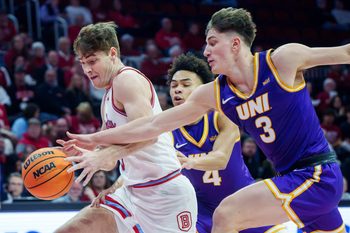 Northern Iowa's Max Weisbrod tries to knock the ball away from Bradley's Alex Huibregtse in the first half of their college basketball game Saturday, Jan. 10, 2026 at Carver Arena in Peoria. The Braves defeated the Panthers 75-69.