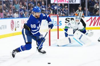 Jan 10, 2026; Toronto, Ontario, CAN; Toronto Maple Leafs right wing William Nylander (88) stick handles the puck at the side of the Vancouver Canucks net during the third period at Scotiabank Arena. Mandatory Credit: Nick Turchiaro-Imagn Images
