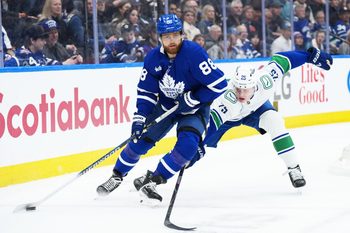 Jan 10, 2026; Toronto, Ontario, CAN; Toronto Maple Leafs right wing William Nylander (88) skates with the puck as Vancouver Canucks defenseman Elias N. Pettersson (25) tries to defend during the third period at Scotiabank Arena. Mandatory Credit: Nick Turchiaro-Imagn Images