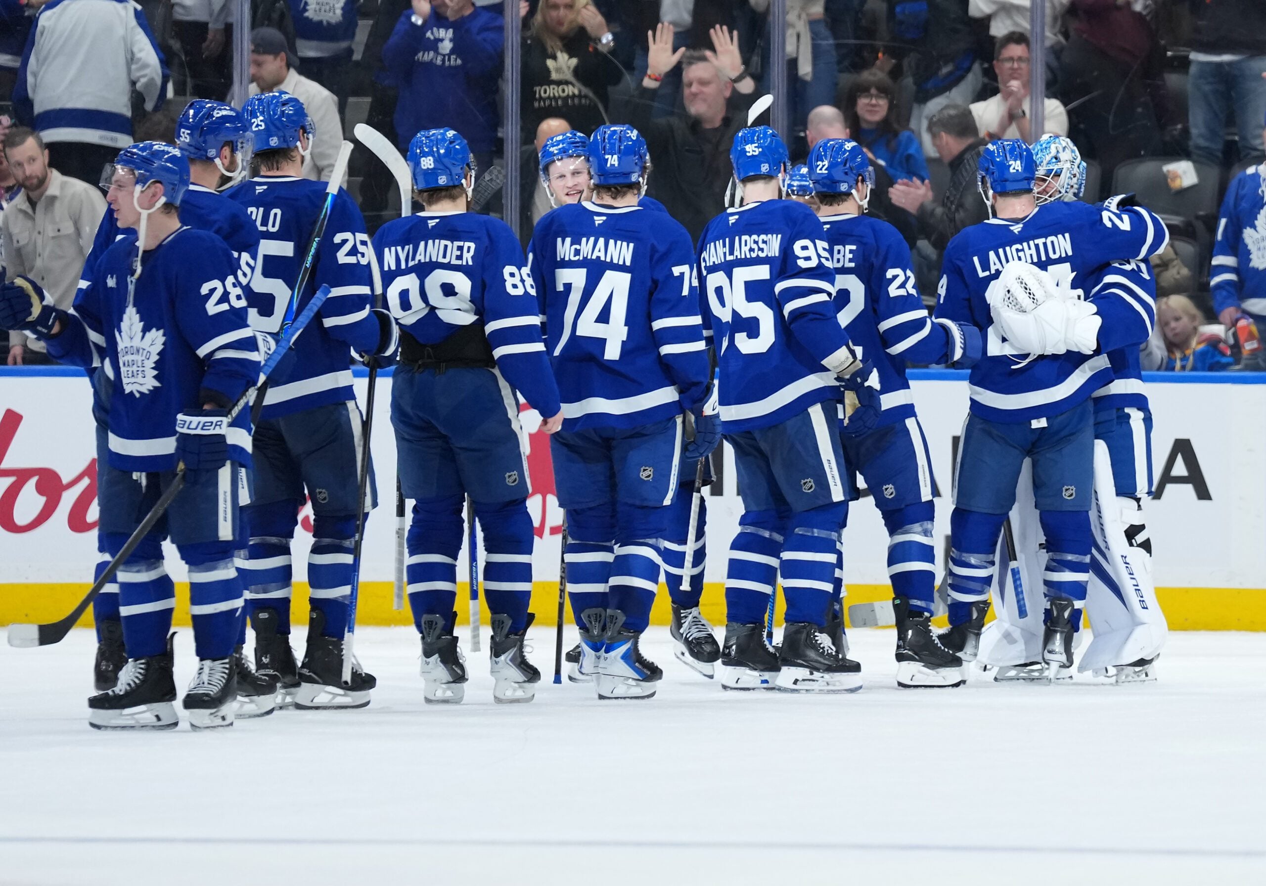 Jan 10, 2026; Toronto, Ontario, CAN; Toronto Maple Leafs goaltender Joseph Woll (60) celebrates the win with center Scott Laughton (24) against the Vancouver Canucks at the end of the third period at Scotiabank Arena. Mandatory Credit: Nick Turchiaro-Imagn Images