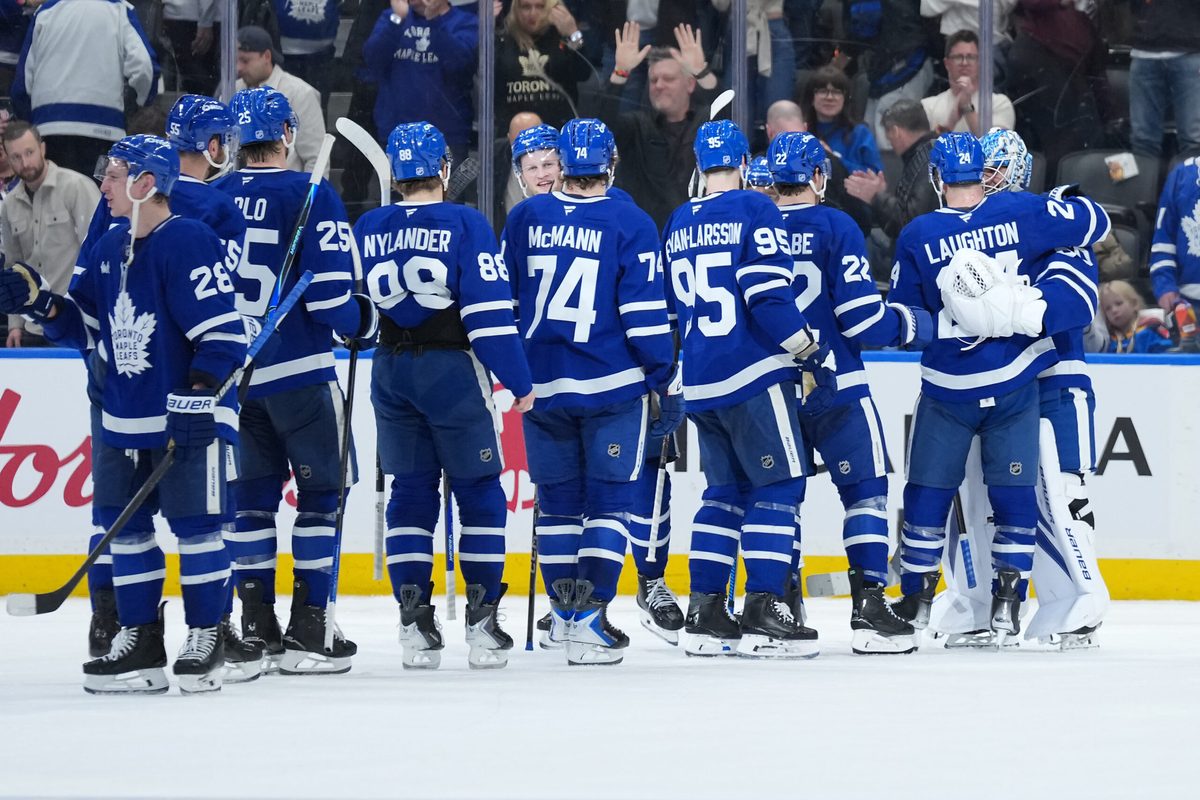 Jan 10, 2026; Toronto, Ontario, CAN; Toronto Maple Leafs goaltender Joseph Woll (60) celebrates the win with center Scott Laughton (24) against the Vancouver Canucks at the end of the third period at Scotiabank Arena. Mandatory Credit: Nick Turchiaro-Imagn Images