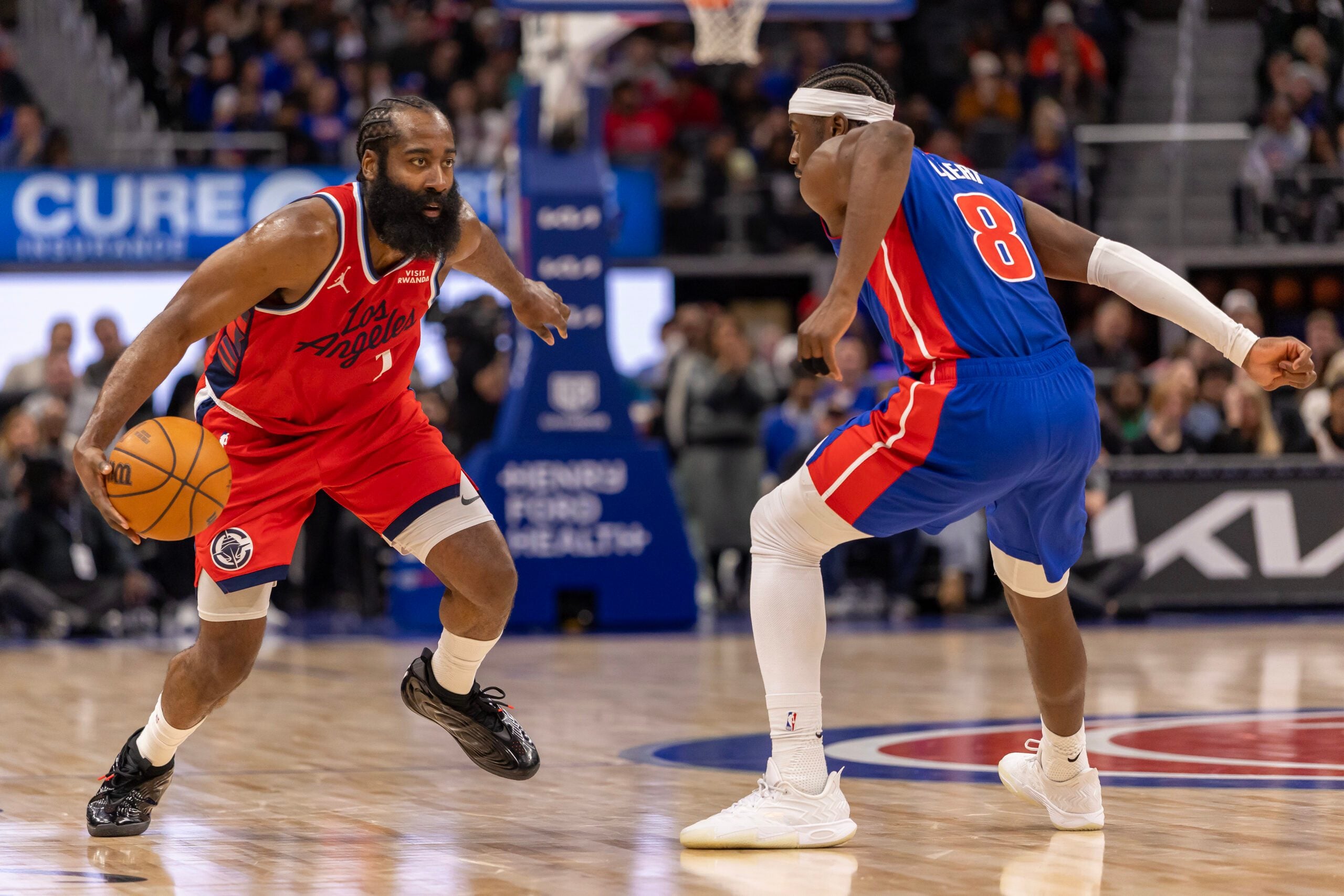 Jan 10, 2026; Detroit, Michigan, USA; Detroit Pistons guard Caris LeVert (8) defends against LA Clippers guard James Harden (1) during the second half at Little Caesars Arena. Mandatory Credit: David Reginek-Imagn Images