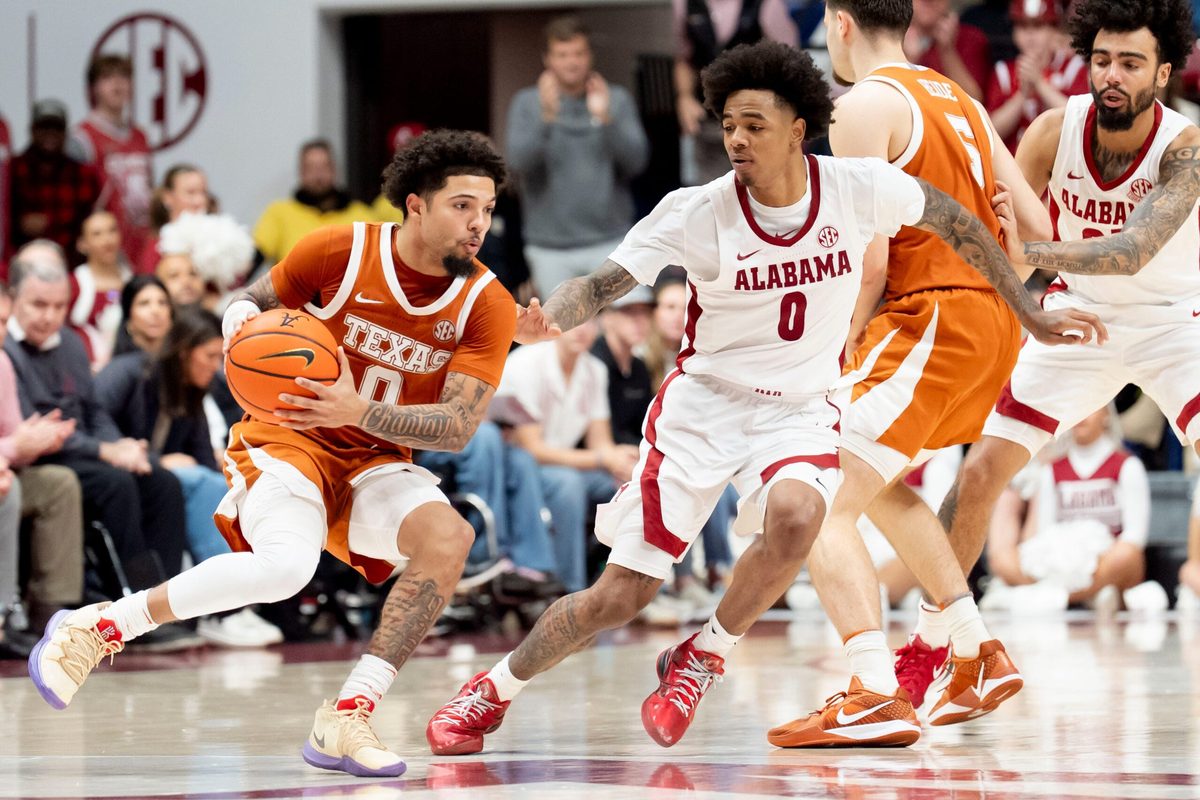 Jan 10, 2026; Tuscaloosa, AL, USA; Alabama guard Labaron Philon Jr. (0) defends as Texas guard Jordan Pope (0) maneuvers for a shot at Coleman Coliseum. Texas defeated Alabama 92-88. Mandatory Credit: Gary Cosby Jr.-Tuscaloosa News