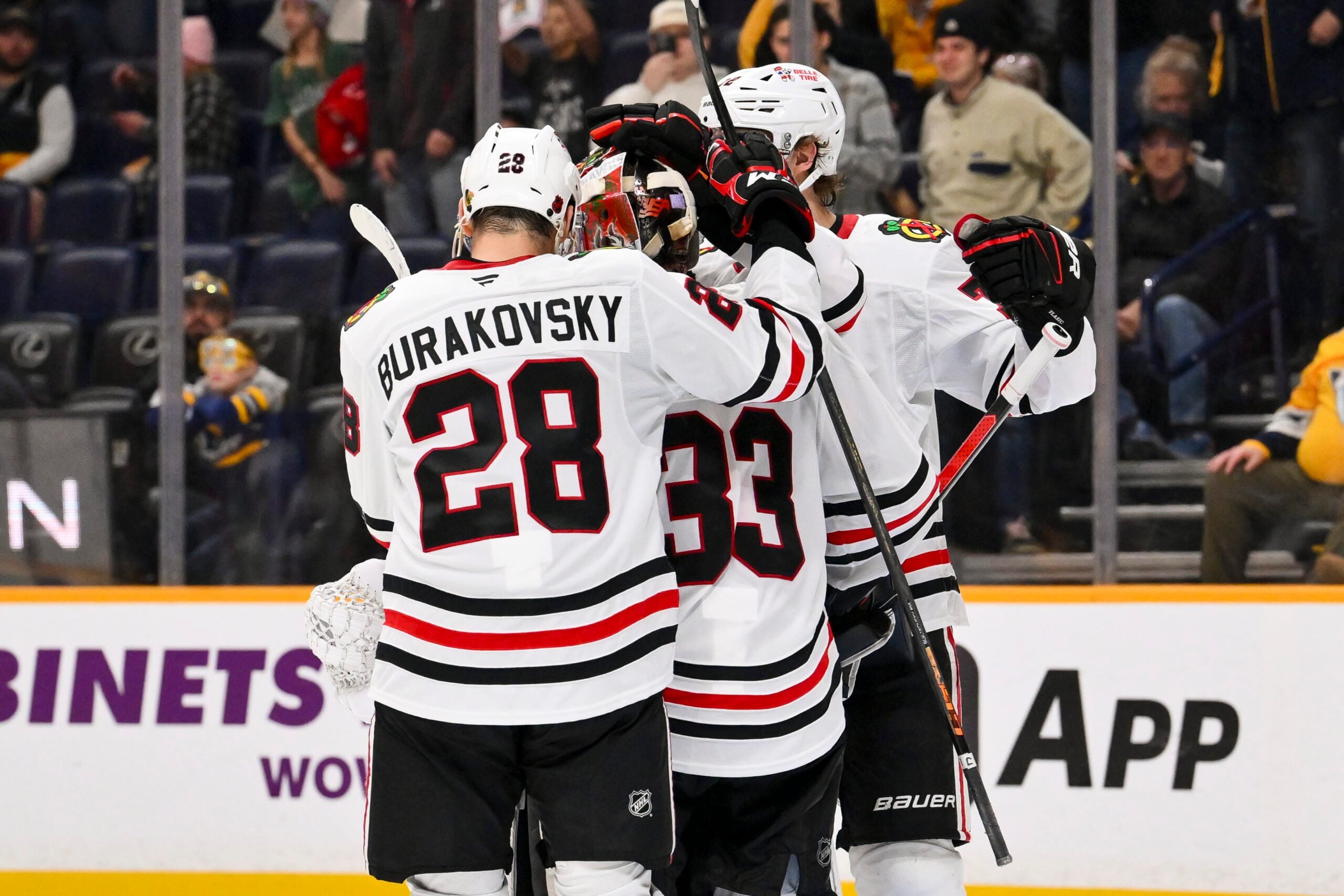 Jan 10, 2026; Nashville, Tennessee, USA;  Chicago Blackhawks goaltender Drew Commesso (33) celebrates the win with his teammates against the Nashville Predators during the third period at Bridgestone Arena. Mandatory Credit: Steve Roberts-Imagn Images