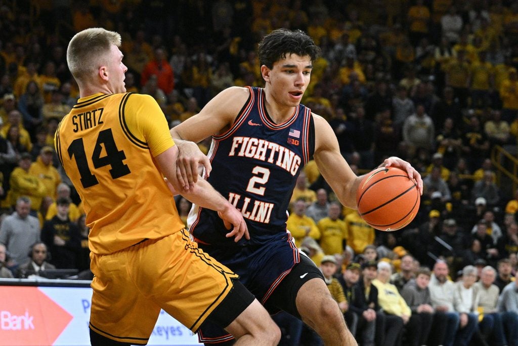 Jan 11, 2026; Iowa City, Iowa, USA; Illinois Fighting Illini guard Andrej Stojakovic (2) goes to the basket as Iowa Hawkeyes guard Bennett Stirtz (14) defends during the first half at Carver-Hawkeye Arena. Mandatory Credit: Jeffrey Becker-Imagn Images