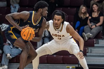 Iona's Lamin Sabally defends against Bryan Ndjonga of Canisius during a MAAC conference basketball game at Iona University in New Rochelle Jan. 11, 2026. Iona defeated Canisius 74-58.